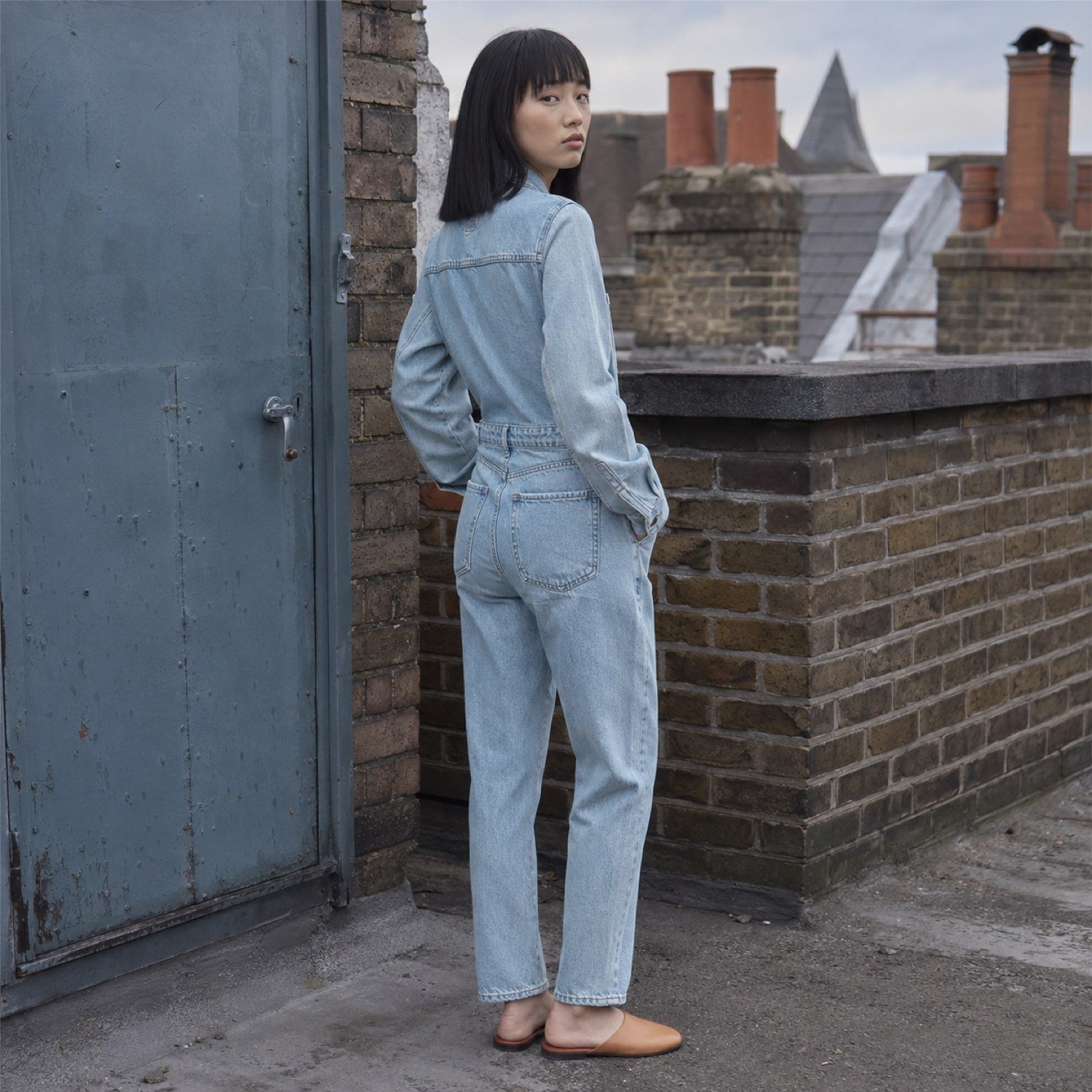 Marshall Denim Boilersuit — Dungarees by YOON SYM. worn by a model, side view.