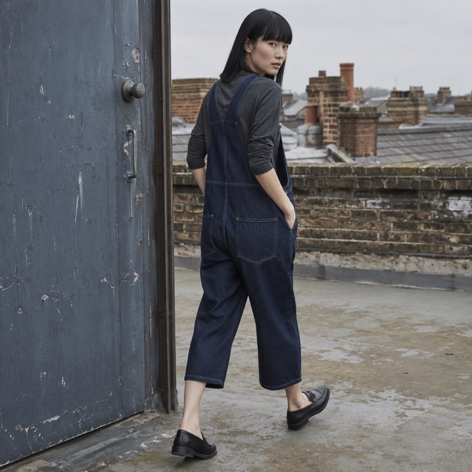 Warwick Cropped Dungarees — Dungarees by YOON SYM. worn by a model, side view.