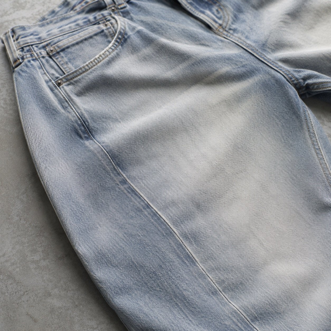 Warwick Barrel Leg Jean — Jeans by YOON SYM. close detail of the fabric and finish.