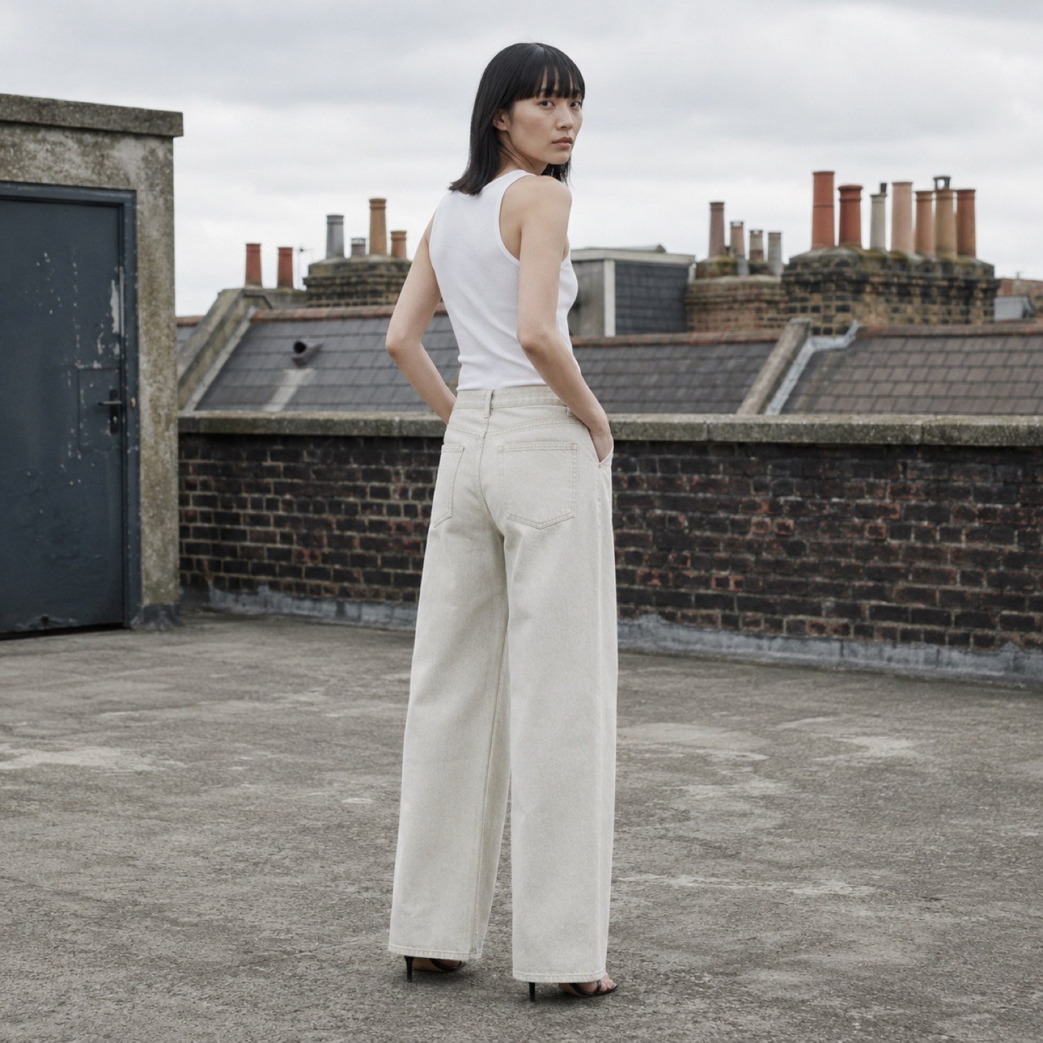 Noel Wide Leg Jean — Jeans by YOON SYM. worn by a model, side view.