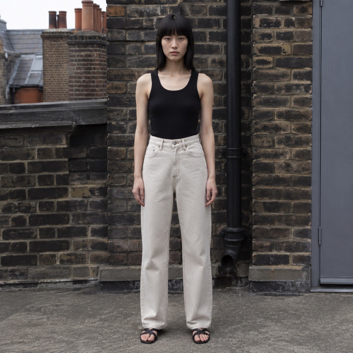 Denman High Rise Straight Jean — Jeans by YOON SYM. worn by a model.