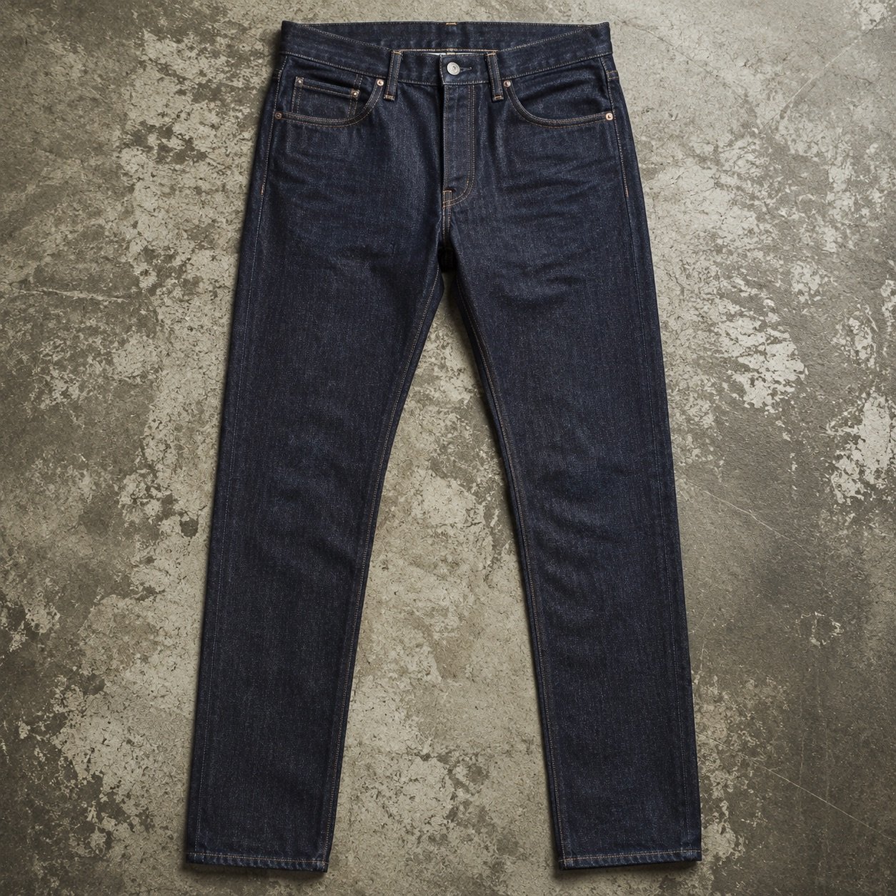 Warwick Slim Tapered Jean — Jeans by YOON SYM. close detail of the fabric and finish.