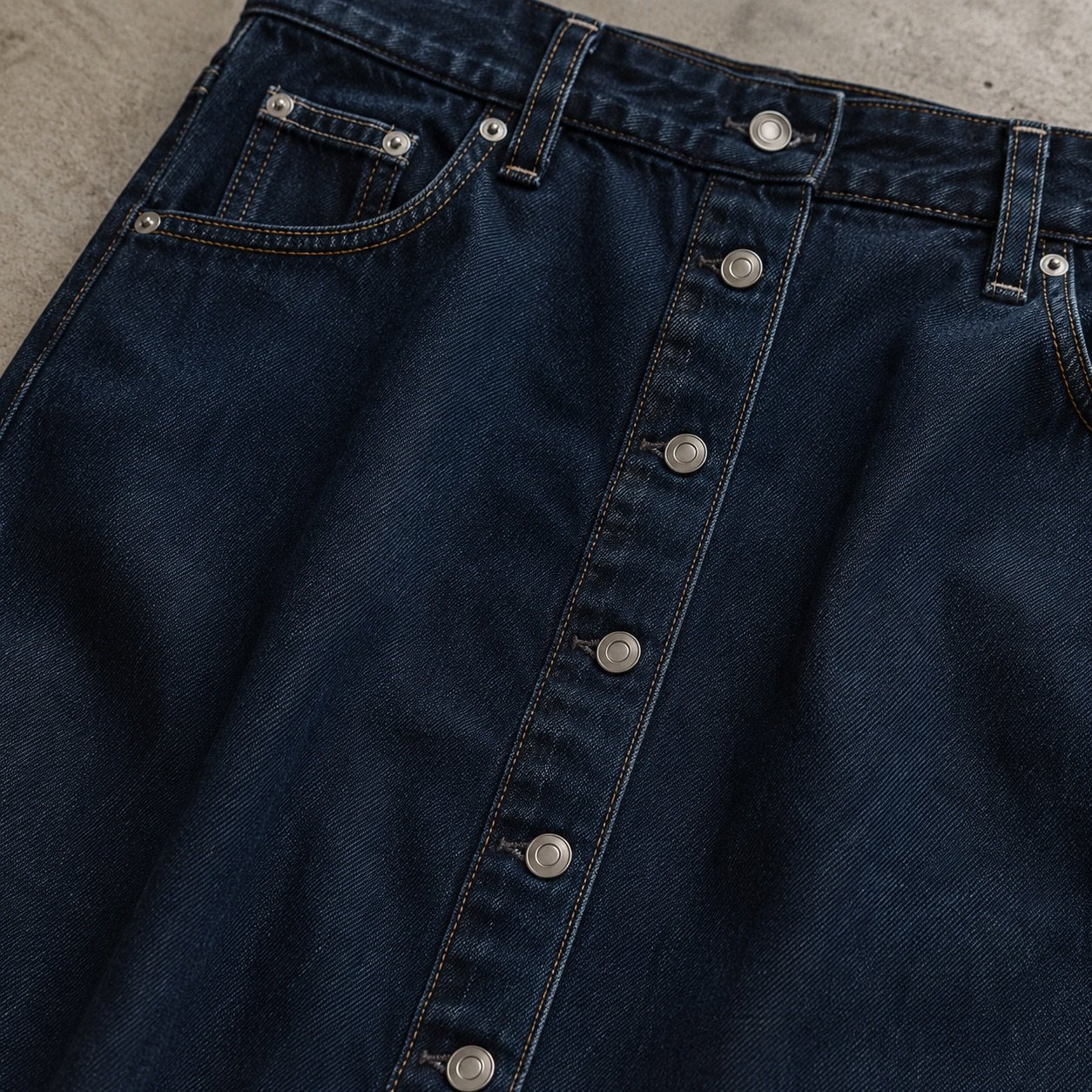 Ganton Button Front Denim Skirt — Skirts & Dresses by YOON SYM. close detail of the fabric and finish.