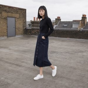 Ganton Button Front Denim Skirt — Skirts & Dresses by YOON SYM. worn by a model.