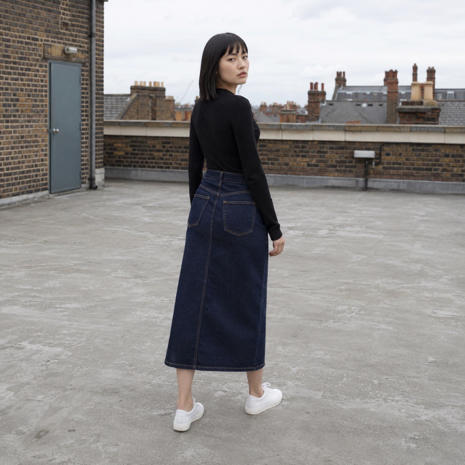 Ganton Button Front Denim Skirt — Skirts & Dresses by YOON SYM. worn by a model, side view.