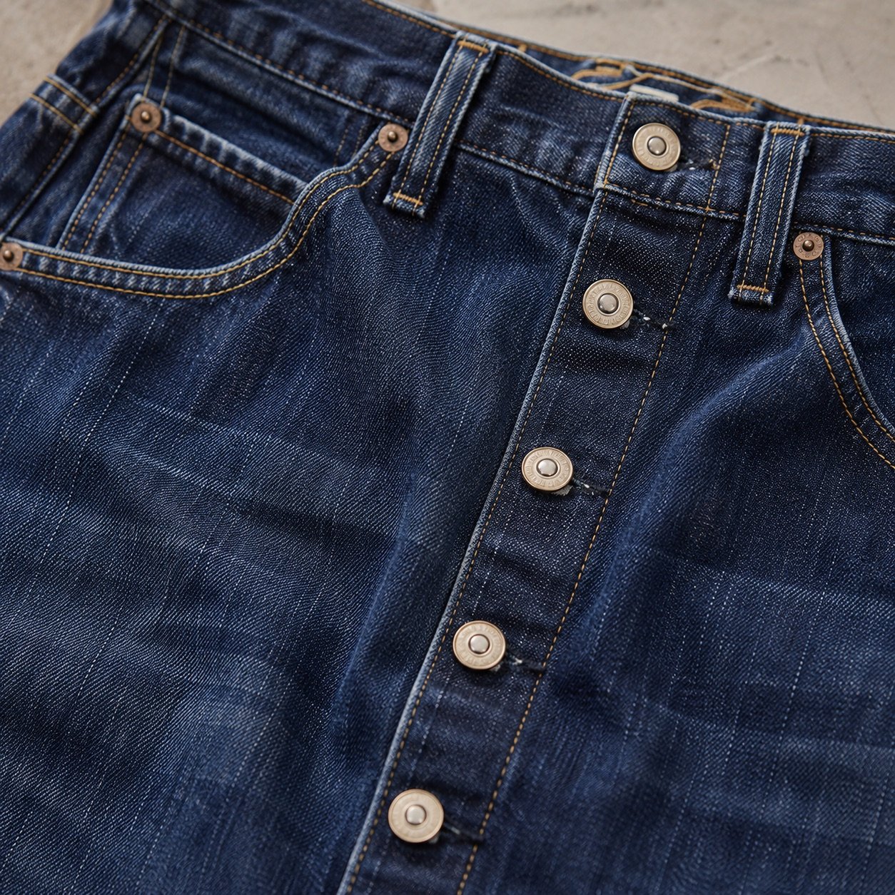 Broadwick Button Front Denim Skirt — Skirts & Dresses by YOON SYM. close detail of the fabric and finish.