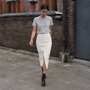Golden Midi Denim Skirt — Skirts & Dresses by YOON SYM. worn by a model.