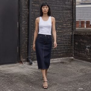 Poland Midi Denim Skirt — Skirts & Dresses by YOON SYM. worn by a model.