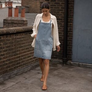 Ganton Denim Pinafore Dress — Skirts & Dresses by YOON SYM. worn by a model.