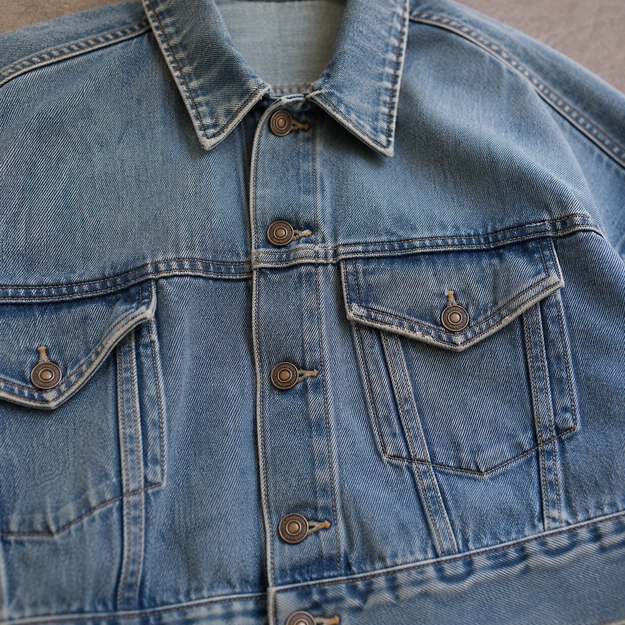 Soho Oversized Trucker Jacket — Denim Jackets by YOON SYM. close detail of the fabric and finish.