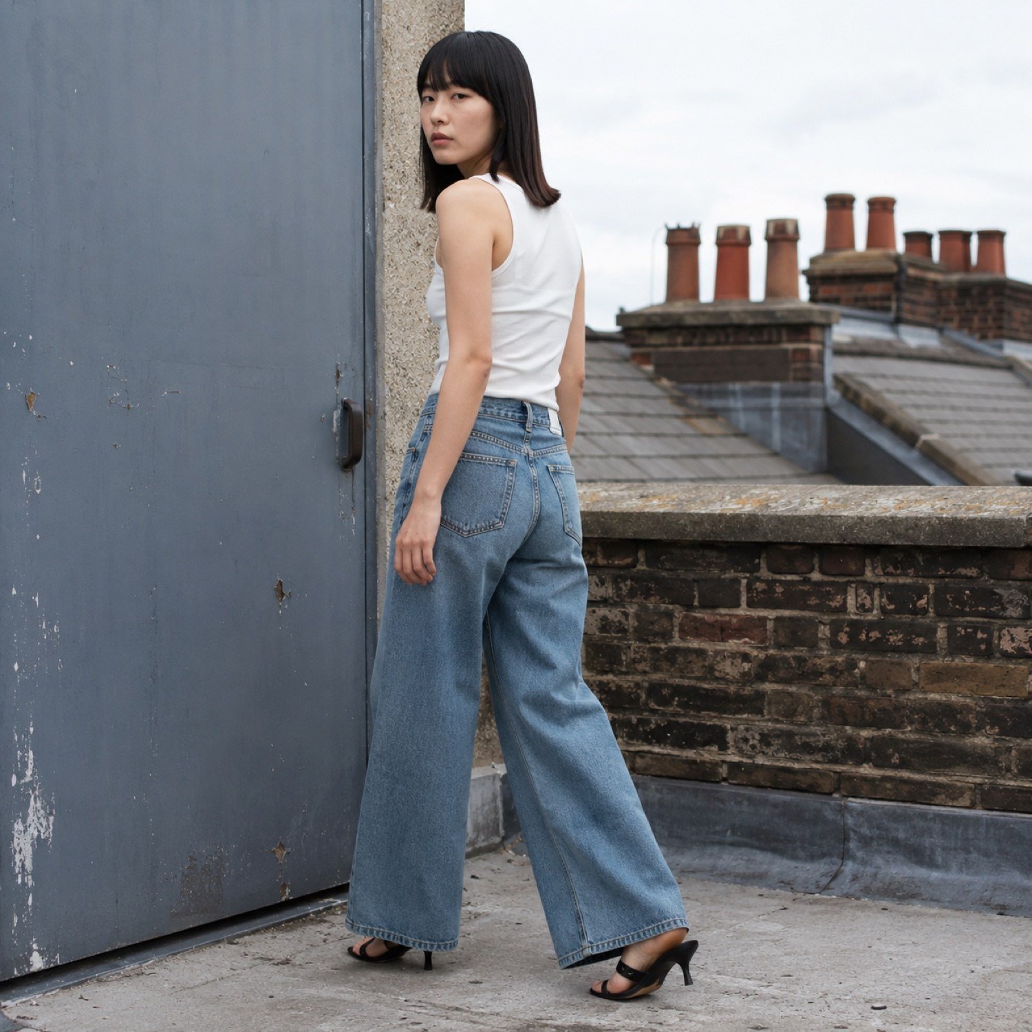 YOON SYM: Kingly Wide Leg Jean, Jeans, worn by a model, side view.