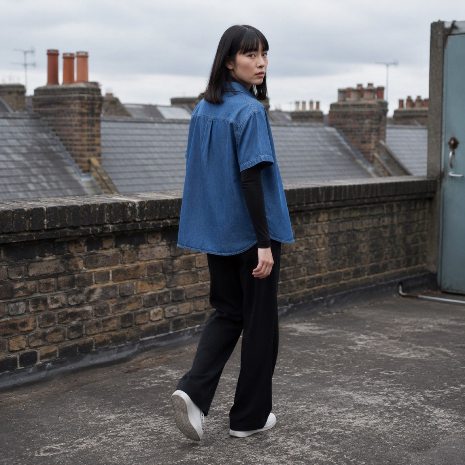 Berwick Short Sleeve Denim Shirt — Denim Shirts by YOON SYM. worn by a model, side view.