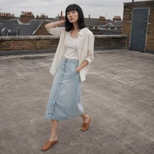 YOON SYM: Broadwick Button Front Denim Skirt, Skirts & Dresses, photographed on a model.
